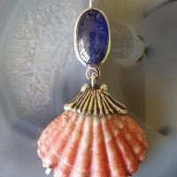 Exclusive shell pendant with a blue Sapphire.